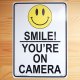 看板/プラサインボード カメラがあるので笑顔で(万引き監視中) Smile! You're on Camera *メール便不可